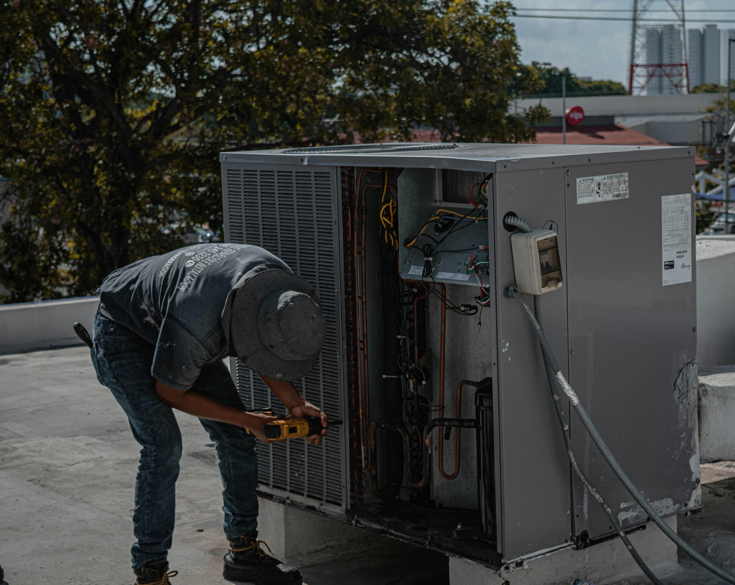 Technician servicing plant equipment — manufacturing insurance and equipment breakdown cover