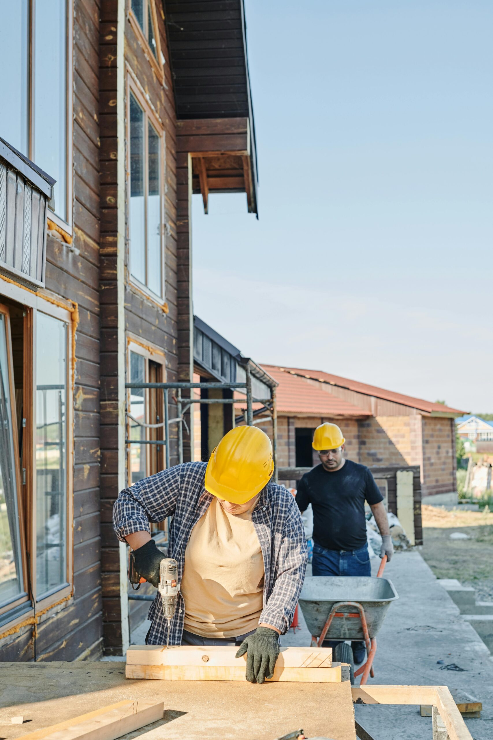 Subcontractors working together on a construction site — contractor insurance and certificate management
