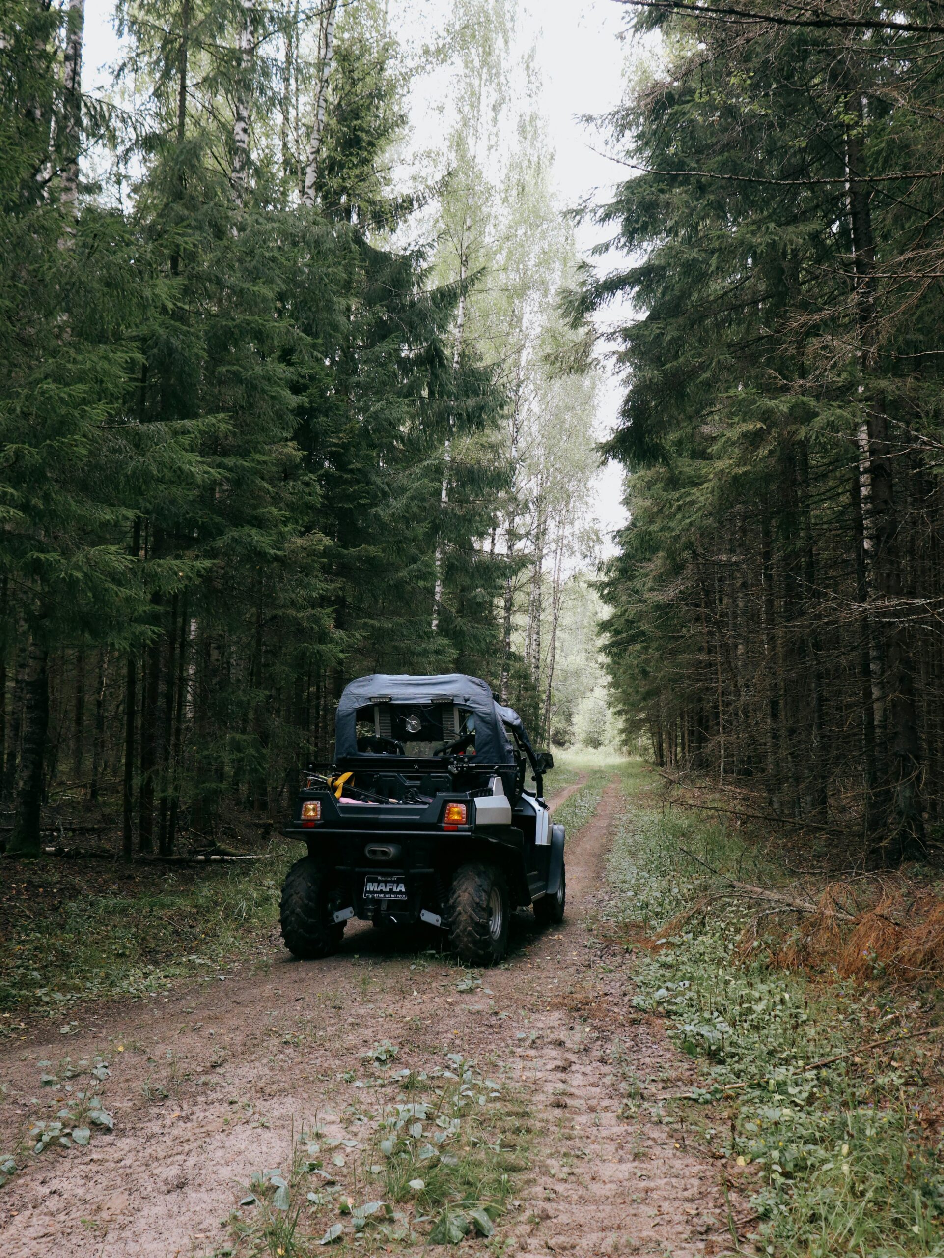 ATV on a forest trail covered by ATV insurance