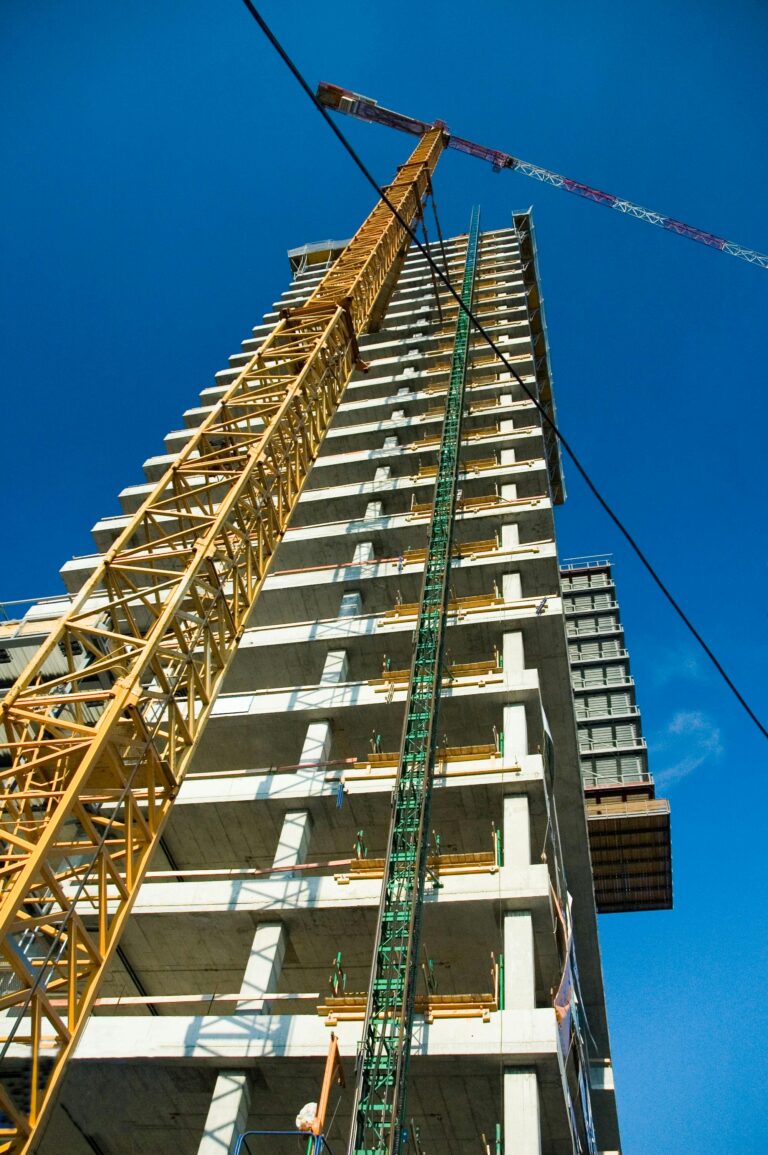 Tower crane over a building under construction — contractor insurance for commercial projects