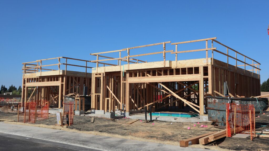 New residential construction with wooden framing on a development site