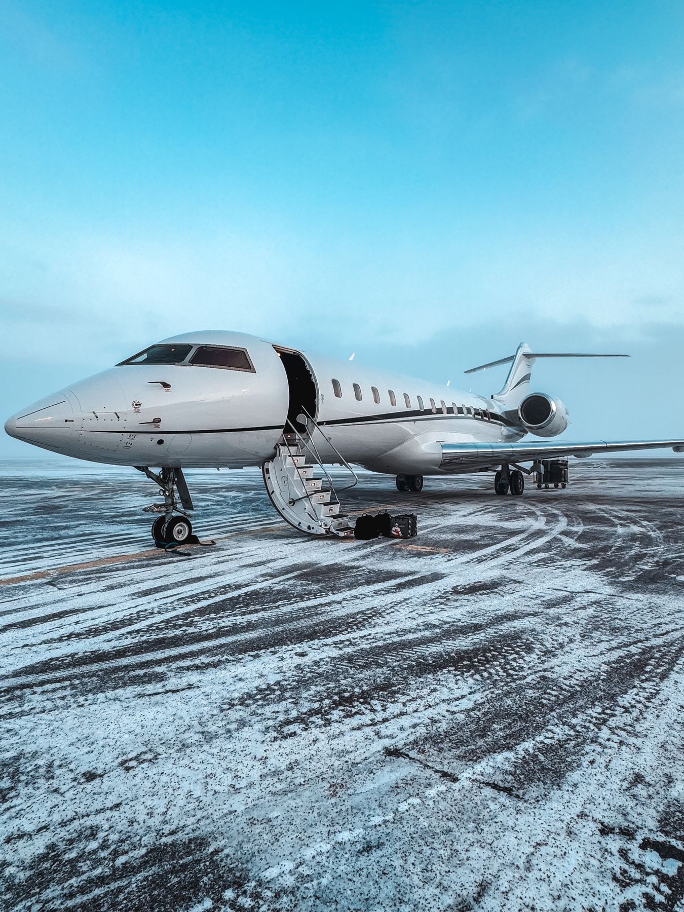 Privately owned aircraft on a winter ramp covered by aviation insurance