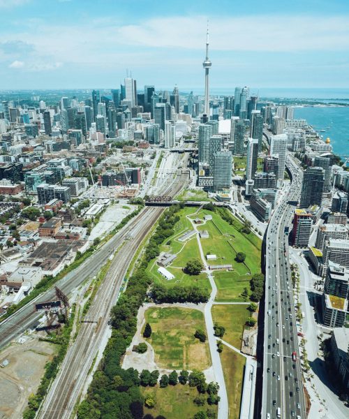 Stunning aerial view of Toronto with the iconic CN Tower and vibrant cityscape.